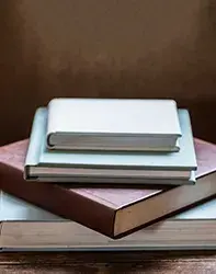 Collection of books with one titled Choose Strong